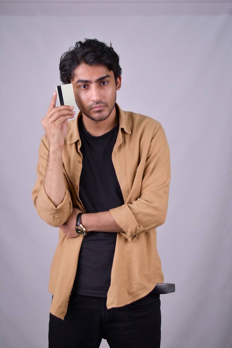 a man holding a cell phone up to his face